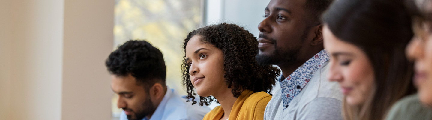 Group of people learning in a classroom setting